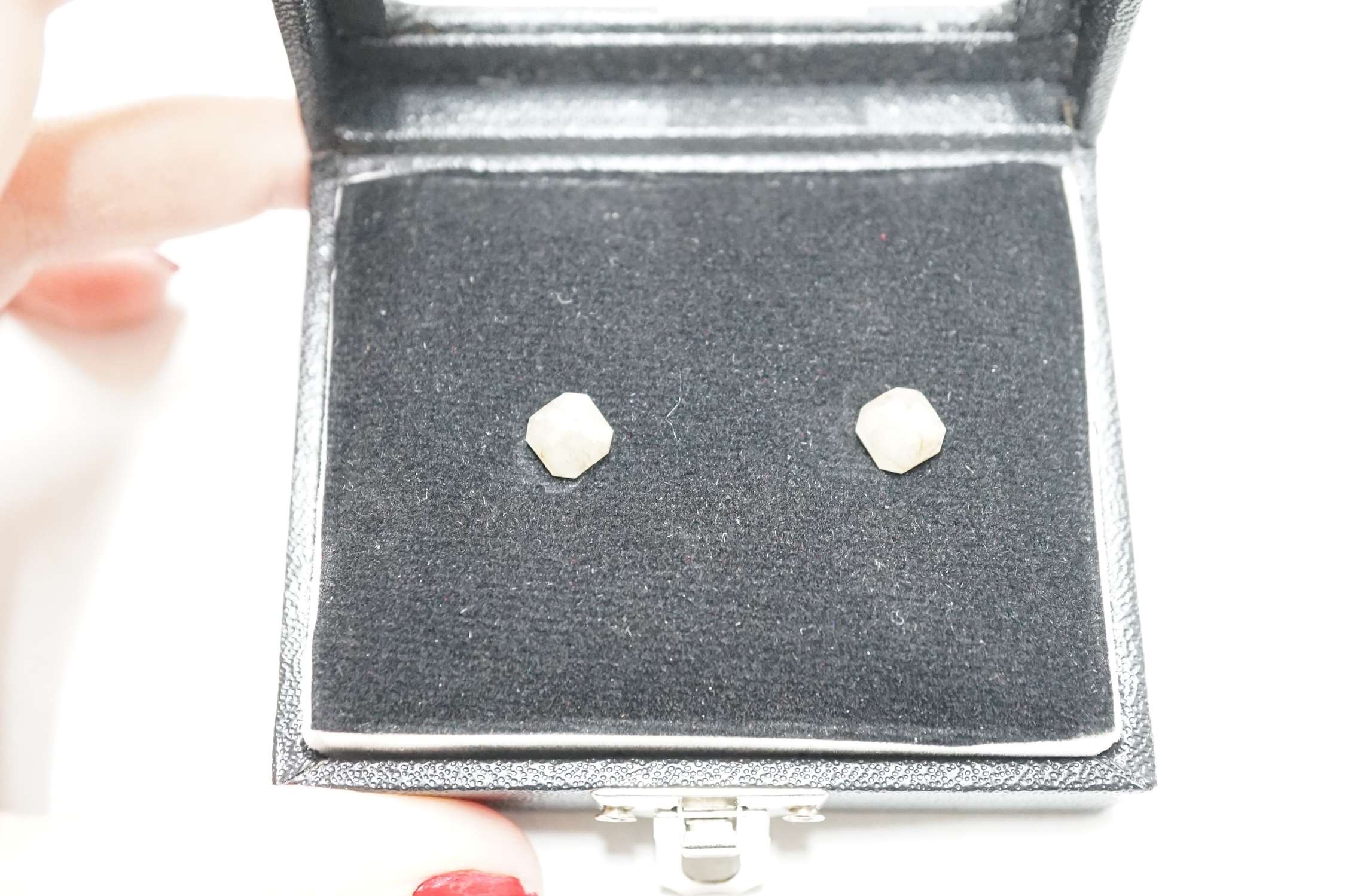 A pair of unmounted cut diamonds, with a total approximate weight of 2.72ct. Condition - poor to fair